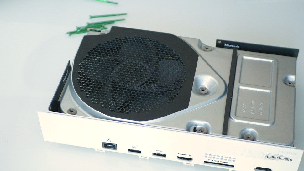 Removing the screws on the bottom opens up the top of the consoles