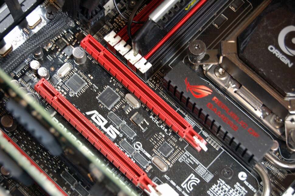 With the graphics card lifted out, you can see the expansion slot it sits in. Graphics cards typically are 'dual slot' in nature. They only use one port, but the cooling assembly is so large, it obscures the second slot