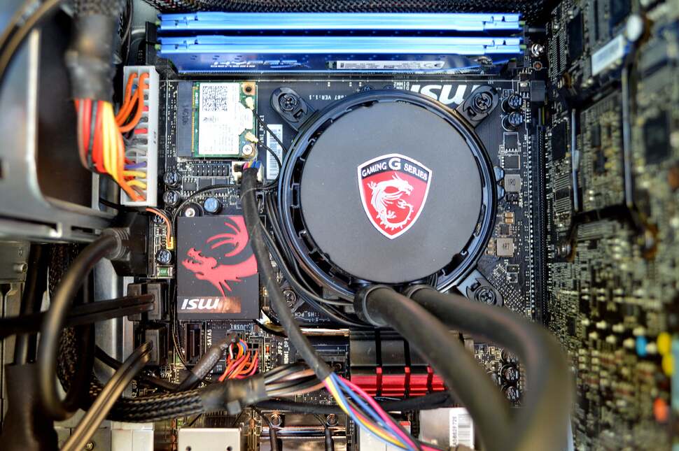 The on-board silicon allows for five SATA 3 ports, three of which are occupied by an optical drive, 120GB mSATA SSD and 1TB HDD. To the top-left of the CPU is Intel's discrete WiFi and Bluetooth 4 chip