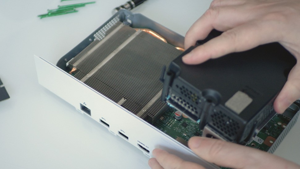 The power supply is on the right and easily removable. It slots in and out