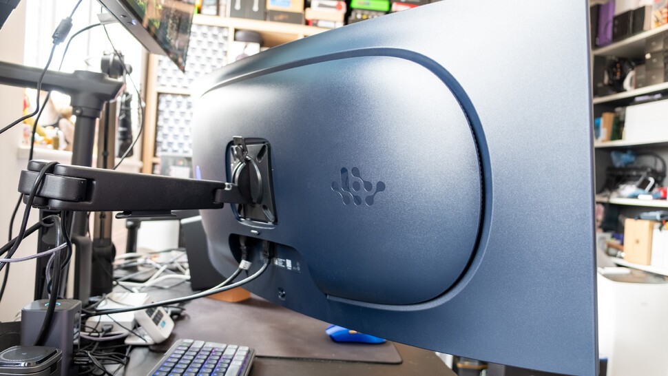 Alienware AW3926QW on a desk with a monitor arm rear view