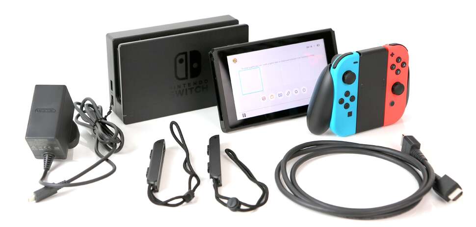 Everything you get in the Switch package, clockwise from left: multi-voltage power supply, dock, Switch tablet, grip with Joy-Cons (mounted), HDMI cable and Joy-Con straps.