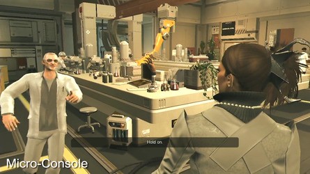 An OnLive micro-console shot of Deus Ex: Human Revolution to the left, the view from the PC game to the right. Default settings on our console seemed to produce a washed-out image which in some situations serves to make compression artefacts more pronounced.