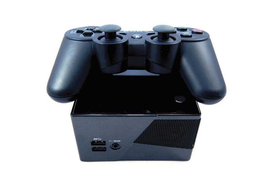 To give you some idea of the size of the Brix Pro, here's a shot comparing it size-wise to a Dual Shock 3 joypad