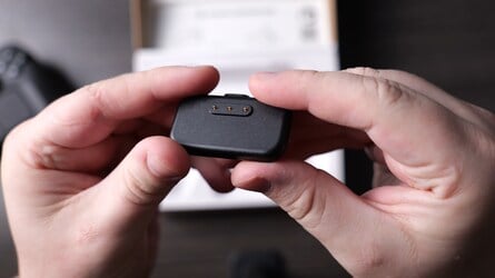 The puck snaps onto the underside of the pad for easy charging, while the large angled trackpads provide a convincing simulacrum of mouse controls.