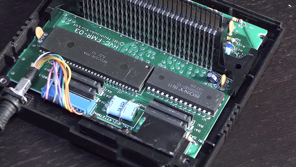 A look inside the RAM cart shows the memory and an IO chip, which also piped extra sound channels through to the console