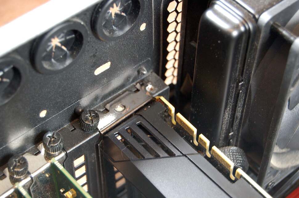 The first order of business is to remove the card from the case. Typically, two screws at the back keep the GPU fixed into place, so remove them