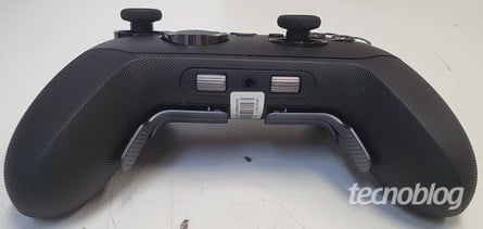 The left photo shows the scroll wheels, which could be used to adjust volume and game/chat mix, while the right photo reveals the rear of the device, including a removable rechargeable battery, lockable triggers and removable rear paddles. Click to enlarge. 