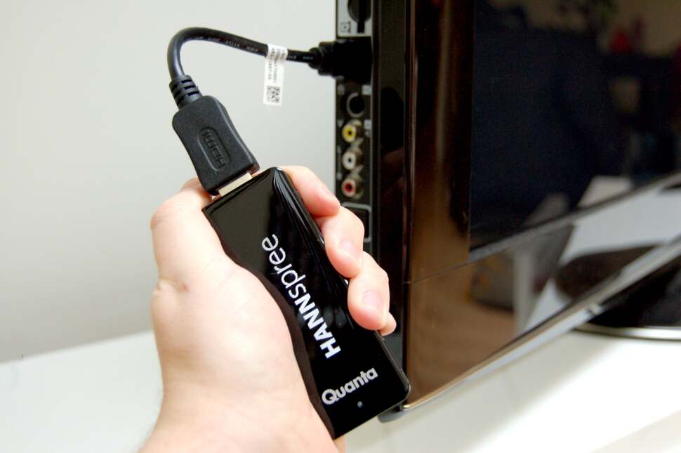 The Micro PC, connected to its male-to-female HDMI extender and slotted into our HDTV. Insert the micro USB power adaptor and you're in business