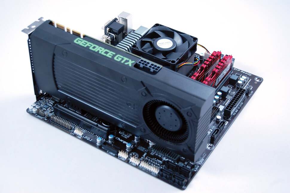 Here's how the graphics card - the GTX 760 - slots into the board. At this point we recommend hooking up a display and power supply to check that the system boots before mounting in the case