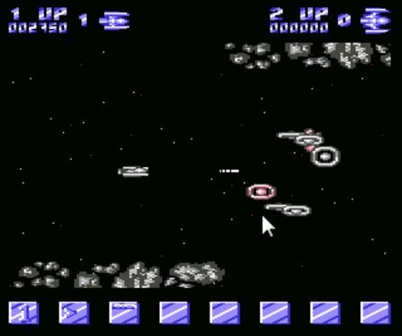 Developers began to push the C64 hardware by exploiting bugs in the VIC-II graphics chip. Sprites were relocated into the borders (as seen in Delta here on the left) while multiplexing the eight available hardware sprites increased the amount of action on-screen (Ikari Warriors, right).
