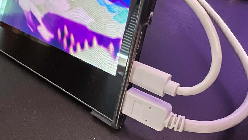 White cables stand out against the black design elsewhere, but they get the job done.