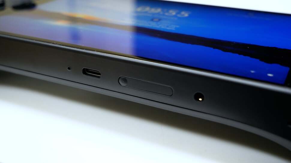 Twin USB-Cs on top, volume control and power button/fingerprint reader