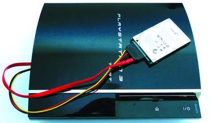 The PS3's stock drive is remove from the unit and we hooked up a SATA extension cable to make swapping between each HDD much easier and faster.