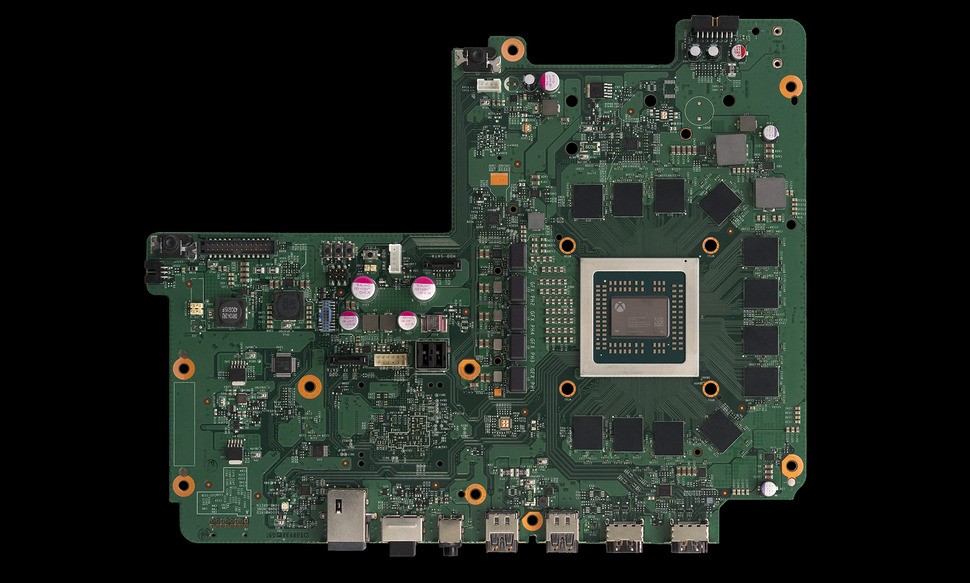 Here's a look at the production Project Scorpio motherboard, with the main processor soldered into place. The IO at the bottom is a match for Xbox One S. Click on the image for a higher resolution image.