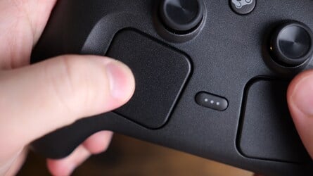 The puck snaps onto the underside of the pad for easy charging, while the large angled trackpads provide a convincing simulacrum of mouse controls.