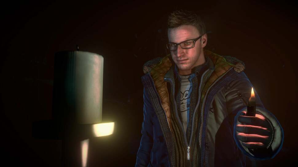 A gameplay shot of Chris up-close. Portable lighters and torches are used to cast light dynamically across each area, and the effect comes across as natural