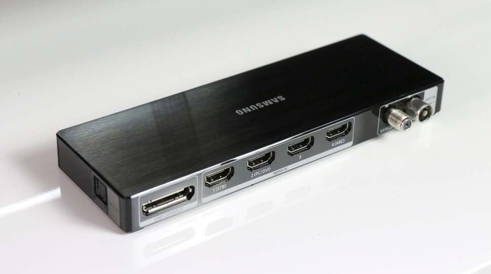 Here's the One Connect box that houses most of the TVs inputs and outputs. The cable that connects this device to the display is a little short, but otherwise we think it’s a neat way of managing connections to the TV while keeping things tidy