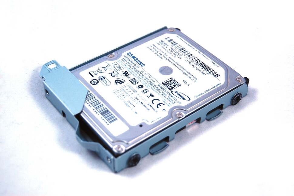 2.5-inch HDDs come in three different heights - 7mm, 9.5mm and 12.5mm. The PS4 appears able to accommodate all three types, unlike the PS3. This 1TB 12.5mm Samsung drives fits tightly into the caddy