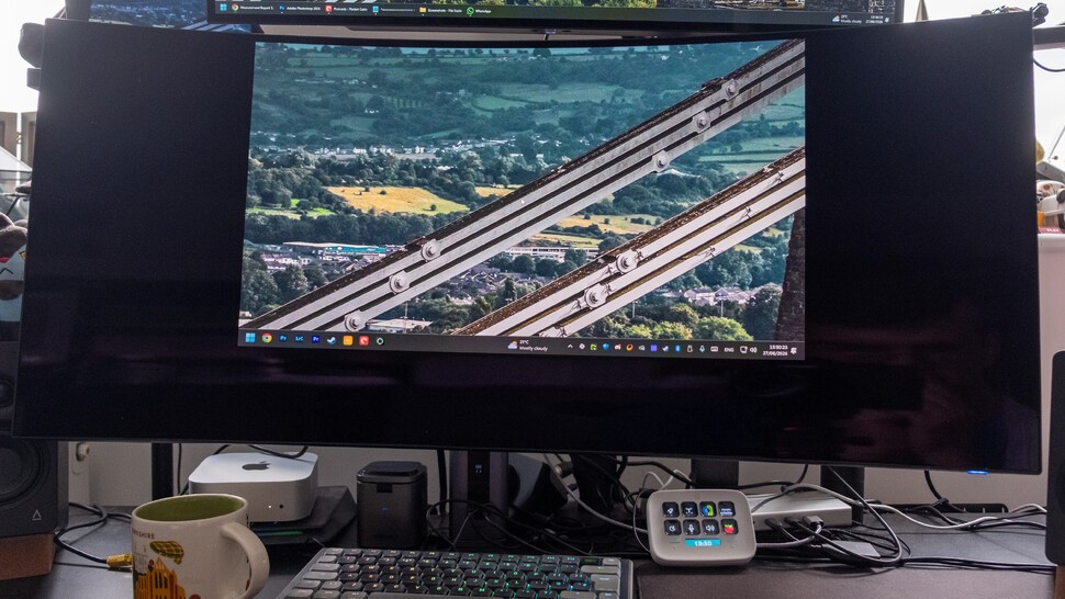 Alienware AW3926QW on a desk with a monitor arm esports mode