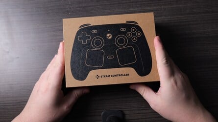The cardboard packaging includes the controller itself, a USB-A cable and the charger/receiver puck. 