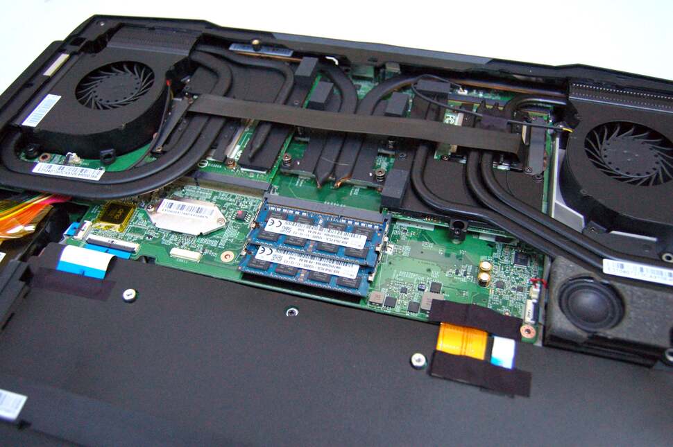 Removing the base of the unit gives you access to more RAM sockets (all populated here), along with the twin MXM PCI Express graphics cards and the elaborate cooling assembly