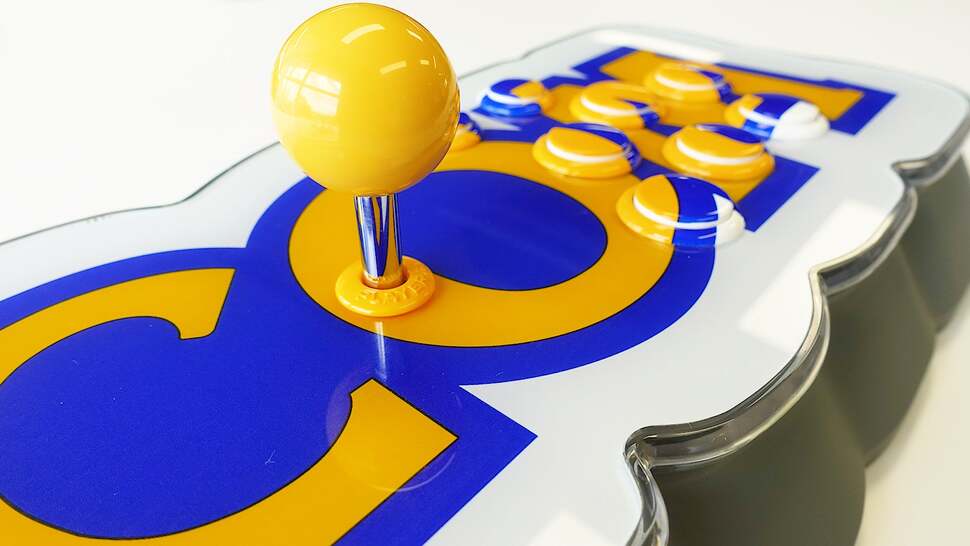 All buttons go unlabeled, but the box does include stickers for the start and credit buttons up top