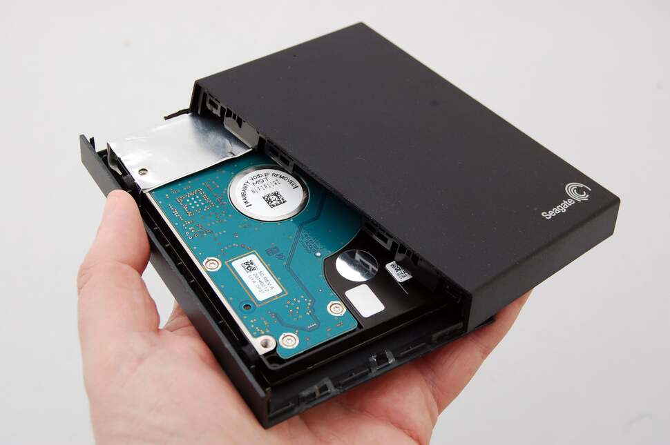 And here we are with the two elements of enclosure pulled apart, and the standard 2.5-inch hard drive finally exposed