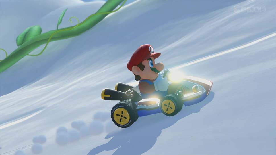 Here we observe the way light interacts with materials. Notice the sunlight glinting off Mario's kart. Also note the clean shadow, soft particles, and tyre tracks