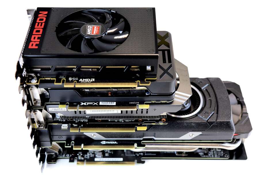 So how small is the Nano? It's on the top here, stacked on top of an R7 360, a seven-inch Zotac GTX 970, a full-length Titan X and at the bottom, the Asus DirectCU rendition of the Radeon R9 390. The Nano is... very small