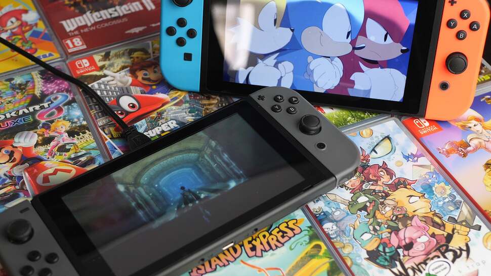 A vanilla Switch (top-right) and our new hardware-modified version - note the USB cable!