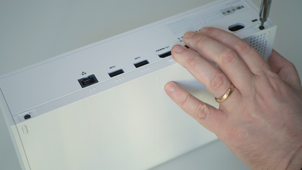 Getting into Series S is a doddle - remove two plastic stickers on the rear, grab a Torx 8 screwdriver and remove the two screws and you're good to go