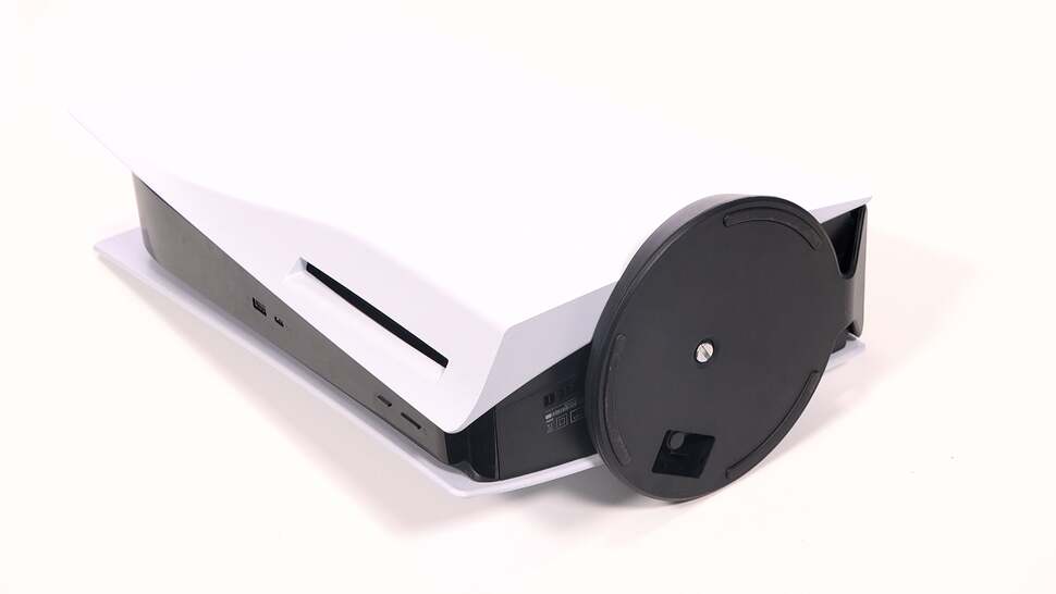 Facing front, it's the right hand 'wing' of the PS5 that needs removing to access the M.2 storage bay