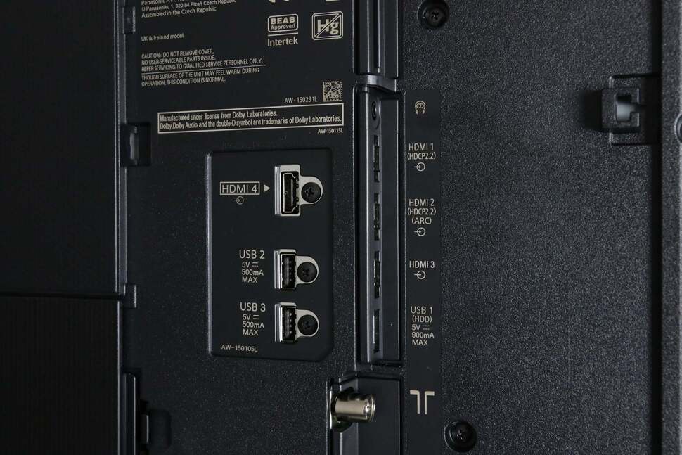 Connections are hidden by removable panels designed to keep cables nice and tidy. Here we find the 4x HDMI, USB, and RF inputs