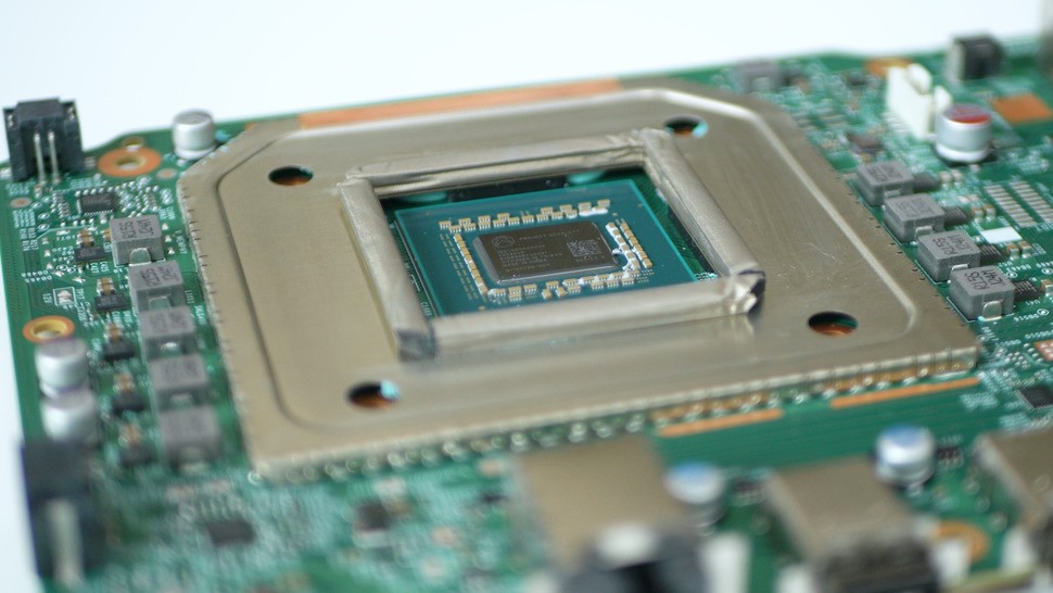 Now we have access to the processor, but a heat shield on the board prevents further progress