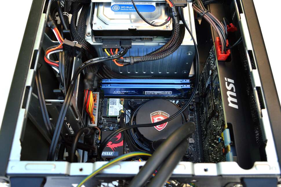 Once opened, the fan connectors are revealed, leading direct to the i5-4670K CPU at its epicentre. Elsewhere, your dual-slot graphics card takes up the single PCIe slot to the right