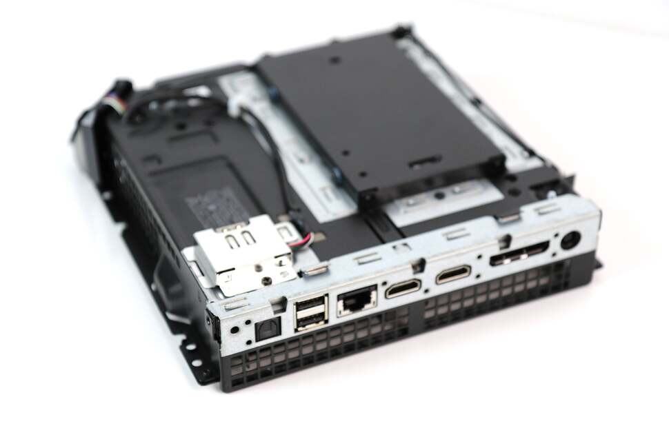 Four screws keep the casing in place. Remove them and accessing the internals is easy - and there's the hard drive cage